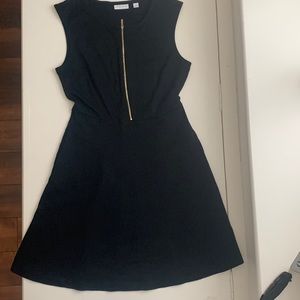 Black dress with gold zipper in front